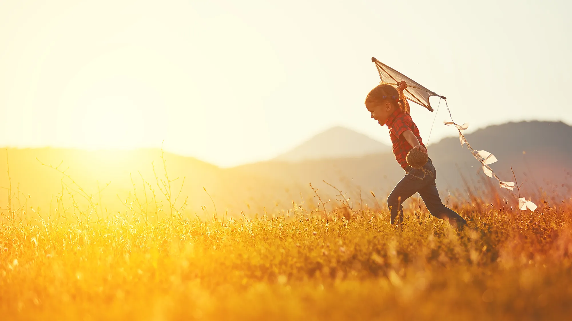 Solar energy — child flying a kite